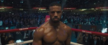Movie still from “Creed II” (2018), directed by Steven Caple Jr. – A person in a boxing ring; Close Up shot, High angle