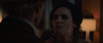 Movie still from “Cry Macho” (2021), directed by Clint Eastwood – A woman looking in the mirror while standing next to a man; Close Up shot, Over the shoulder angle