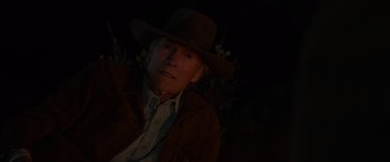 Movie still from “Cry Macho” (2021), directed by Clint Eastwood – An older man wearing a hat and a jacket; Close Up shot, Over the shoulder angle
