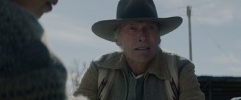 Movie still from “Cry Macho” (2021), directed by Clint Eastwood – An older man wearing a hat and a jacket; Close Up shot, Low angle