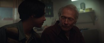 Movie still from “Cry Macho” (2021), directed by Clint Eastwood – A man and a young woman looking at each other; Close Up shot, Over the shoulder angle
