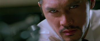Movie still from “Crying Freeman” (1995), directed by Christophe Gans – A man's eyes and face; Extreme Close Up shot, Low angle