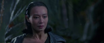 Movie still from “Crying Freeman” (1995), directed by Christophe Gans – A person wearing a black jacket; Close Up shot, Over the shoulder angle