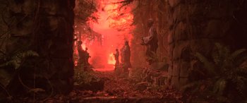 Movie still from “Crying Freeman” (1995), directed by Christophe Gans – A group of people standing next to each other in a forest; Wide shot, Low angle