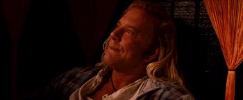 Movie still from “The Wrestler” (2008), directed by Darren Aronofsky – A person with long blonde hair; Close Up shot, Low angle