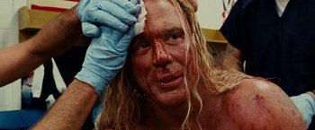 Movie still from “The Wrestler” (2008), directed by Darren Aronofsky – A man with blood all over his face; Close Up shot, Low angle