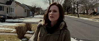 Movie still from “The Wrestler” (2008), directed by Darren Aronofsky – A woman standing on the side of a road; Medium shot, Over the shoulder angle