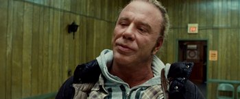 Movie still from “The Wrestler” (2008), directed by Darren Aronofsky – A person with his eyes closed; Close Up shot, Over the shoulder angle