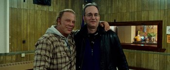 Movie still from “The Wrestler” (2008), directed by Darren Aronofsky – A couple of men standing next to each other; Medium shot, Low angle