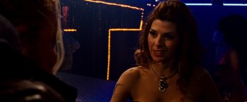 Movie still from “The Wrestler” (2008), directed by Darren Aronofsky – A woman in a black dress and a necklace; Close Up shot, Over the shoulder angle