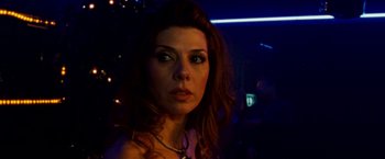 Movie still from “The Wrestler” (2008), directed by Darren Aronofsky – A person with long hair; Close Up shot, Low angle