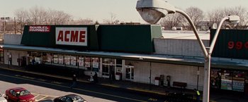 Movie still from “The Wrestler” (2008), directed by Darren Aronofsky – An old movie theater is shown from a distance; Extreme Wide shot, Low angle