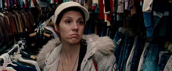 Movie still from “The Wrestler” (2008), directed by Darren Aronofsky – A woman wearing a white hat in a store; Close Up shot, Over the shoulder angle