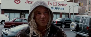 Movie still from “The Wrestler” (2008), directed by Darren Aronofsky – A man with long blonde hair wearing a hooded jacket; Close Up shot, Low angle