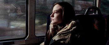 Movie still from “The Wrestler” (2008), directed by Darren Aronofsky – A woman sitting on a train looking out the window; Close Up shot, Over the shoulder angle