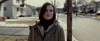Movie still from “The Wrestler” (2008), directed by Darren Aronofsky – A young woman standing on the side of the street; Close Up shot, Over the shoulder angle