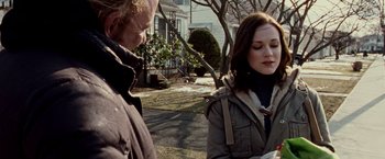 Movie still from “The Wrestler” (2008), directed by Darren Aronofsky – A man and a woman standing on a sidewalk; Close Up shot, Over the shoulder angle