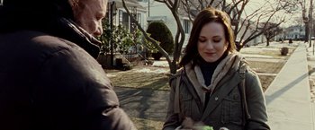 Movie still from “The Wrestler” (2008), directed by Darren Aronofsky – A man and a woman standing on the side of a road; Medium shot, Over the shoulder angle