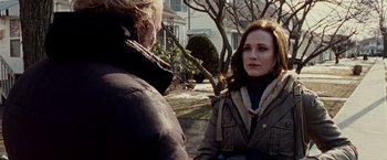 Movie still from “The Wrestler” (2008), directed by Darren Aronofsky – A woman is talking to a man in a brown jacket; Close Up shot, Over the shoulder angle