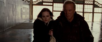 Movie still from “The Wrestler” (2008), directed by Darren Aronofsky – A man and a woman are walking together; Close Up shot, Low angle