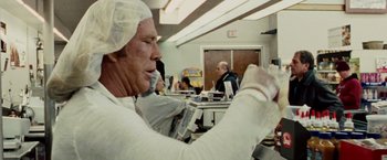 Movie still from “The Wrestler” (2008), directed by Darren Aronofsky – A man in a white lab coat is working in a lab; Close Up shot, Low angle