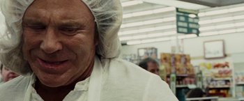 Movie still from “The Wrestler” (2008), directed by Darren Aronofsky – An old man wearing a white head covering; Close Up shot, Over the shoulder angle