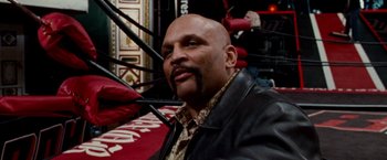 Movie still from “The Wrestler” (2008), directed by Darren Aronofsky – A man with a beard and a leather jacket; Close Up shot, Low angle