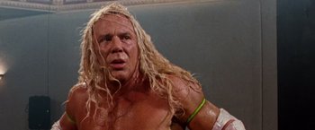 Movie still from “The Wrestler” (2008), directed by Darren Aronofsky – A person with long blonde hair; Close Up shot, Low angle