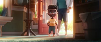 Movie still from “DC League of Super-Pets” (2022), directed by Jared Stern – A little boy standing in front of a person; Wide shot, Over the shoulder angle