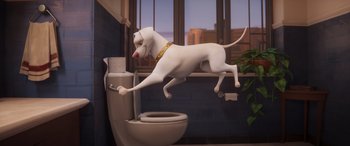 Movie still from “DC League of Super-Pets” (2022), directed by Jared Stern – A dog jumping in front of a toilet in a bathroom; Wide shot, High angle
