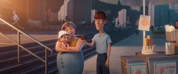 Movie still from “DC League of Super-Pets” (2022), directed by Jared Stern – An animated scene of a boy and a woman with a baby; Medium shot, Over the shoulder angle