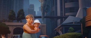 Movie still from “DC League of Super-Pets” (2022), directed by Jared Stern – An animated woman holding a baby next to a statue; Medium shot, Over the shoulder angle