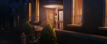 Movie still from “DC League of Super-Pets” (2022), directed by Jared Stern – A woman in a green dress standing in a doorway; Wide shot, Low angle
