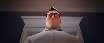 Movie still from “DC League of Super-Pets” (2022), directed by Jared Stern – An animated man with glasses looking up at the sky; Close Up shot, Low angle