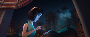 Movie still from “DC League of Super-Pets” (2022), directed by Jared Stern – A woman holding a cell phone in front of a building; Medium shot, Low angle