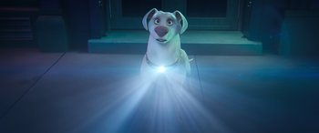 Movie still from “DC League of Super-Pets” (2022), directed by Jared Stern – A dog with a light shining on it's head; Medium shot, Low angle
