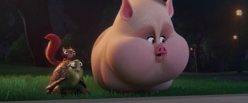 Movie still from “DC League of Super-Pets” (2022), directed by Jared Stern – An animated pig and a bird in the grass; Medium shot, Low angle