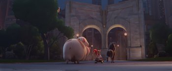 Movie still from “DC League of Super-Pets” (2022), directed by Jared Stern – A group of animals that are standing in the street; Wide shot, Low angle