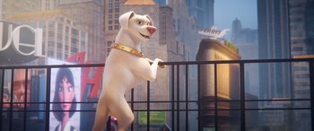 Movie still from “DC League of Super-Pets” (2022), directed by Jared Stern – A statue of a white dog with a gold collar; Wide shot, Over the shoulder angle