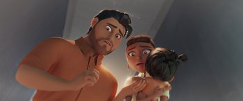 Movie still from “DC League of Super-Pets” (2022), directed by Jared Stern – A couple of people standing next to each other holding a baby; Close Up shot, Low angle