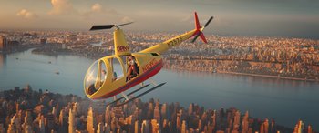 Movie still from “DC League of Super-Pets” (2022), directed by Jared Stern – A helicopter flying over a city with a person sitting in the cockpit; Extreme Wide shot, High angle