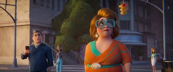 Movie still from “DC League of Super-Pets” (2022), directed by Jared Stern – An animated woman in a red and orange dress; Medium shot, Over the shoulder angle