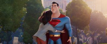 Movie still from “DC League of Super-Pets” (2022), directed by Jared Stern – A woman is hugging a man in a superman costume; Medium shot, Low angle