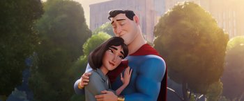 Movie still from “DC League of Super-Pets” (2022), directed by Jared Stern – A man and a woman hugging each other in front of a building; Close Up shot, Low angle
