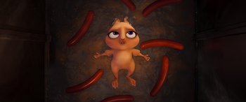 Movie still from “DC League of Super-Pets” (2022), directed by Jared Stern – An illustration of an animal surrounded by sausages; Close Up shot, Overhead angle