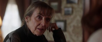 Movie still from “Dangerous” (2021), directed by David Hackl – An older woman talking on a cell phone; Close Up shot, Over the shoulder angle