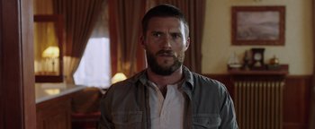 Movie still from “Dangerous” (2021), directed by David Hackl – A person with a beard; Close Up shot, Over the shoulder angle