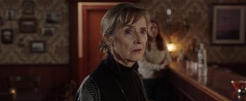 Movie still from “Dangerous” (2021), directed by David Hackl – An older woman is standing in front of another woman; Close Up shot, Over the shoulder angle