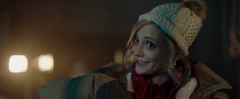 Movie still from “Dangerous” (2021), directed by David Hackl – A woman wearing a hat and a scarf; Close Up shot, Over the shoulder angle