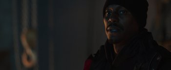 Movie still from “Dangerous” (2021), directed by David Hackl – A person wearing a hat and jacket; Close Up shot, Low angle